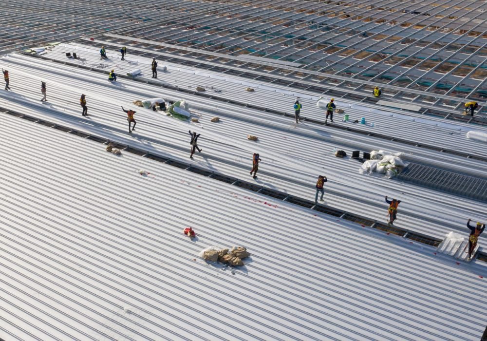 Professional-roofing-contractors-installing-a-commercial-metal-roof